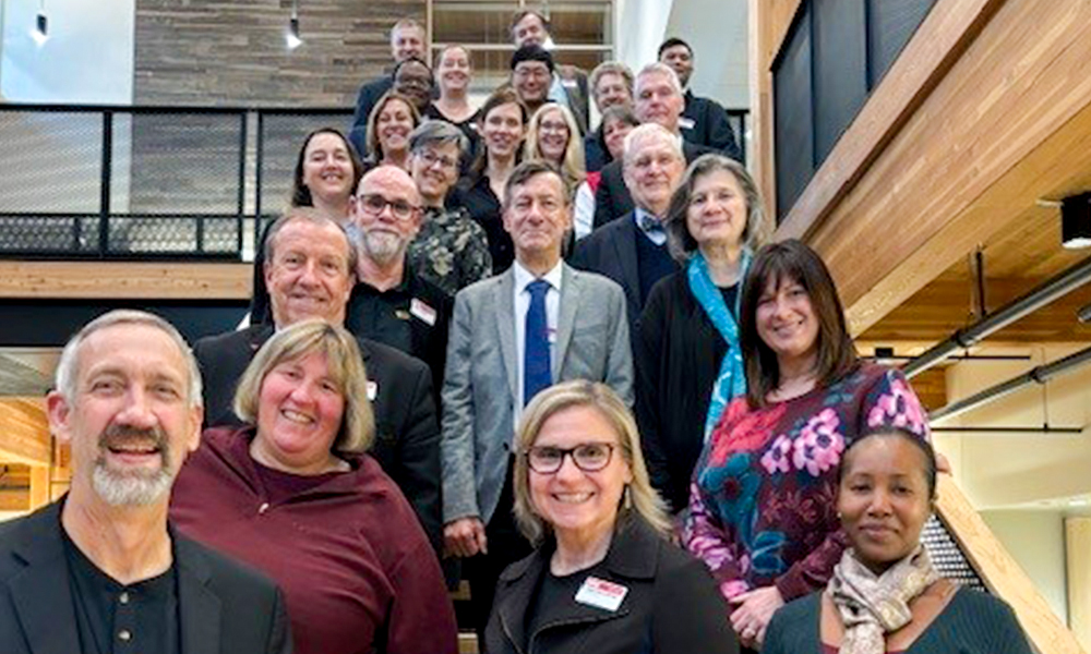 2025 SPIE officers and directors pose together in a stairwell