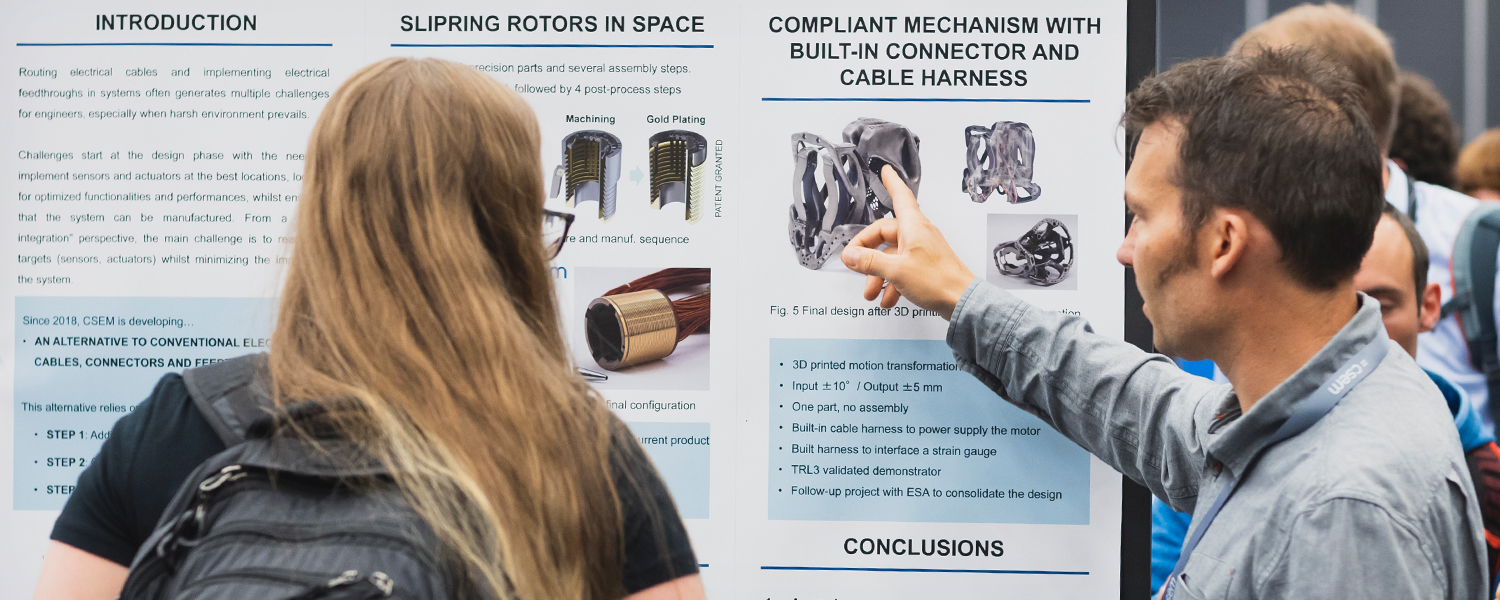 Poster presenter explaining their research at SPIE Astronomical Telescopes + Instrumentation