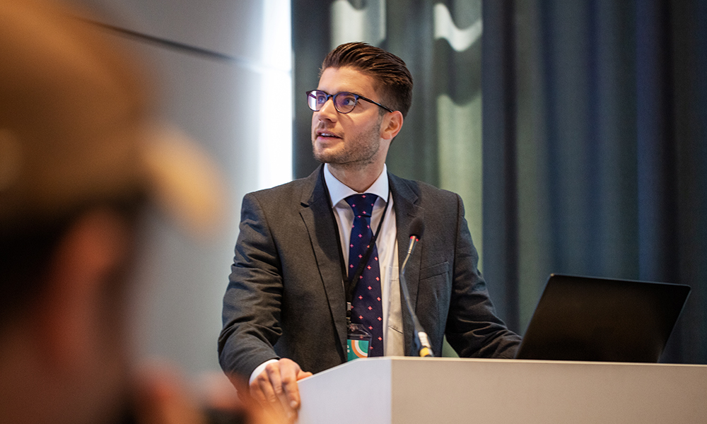 Person presenting at a podium