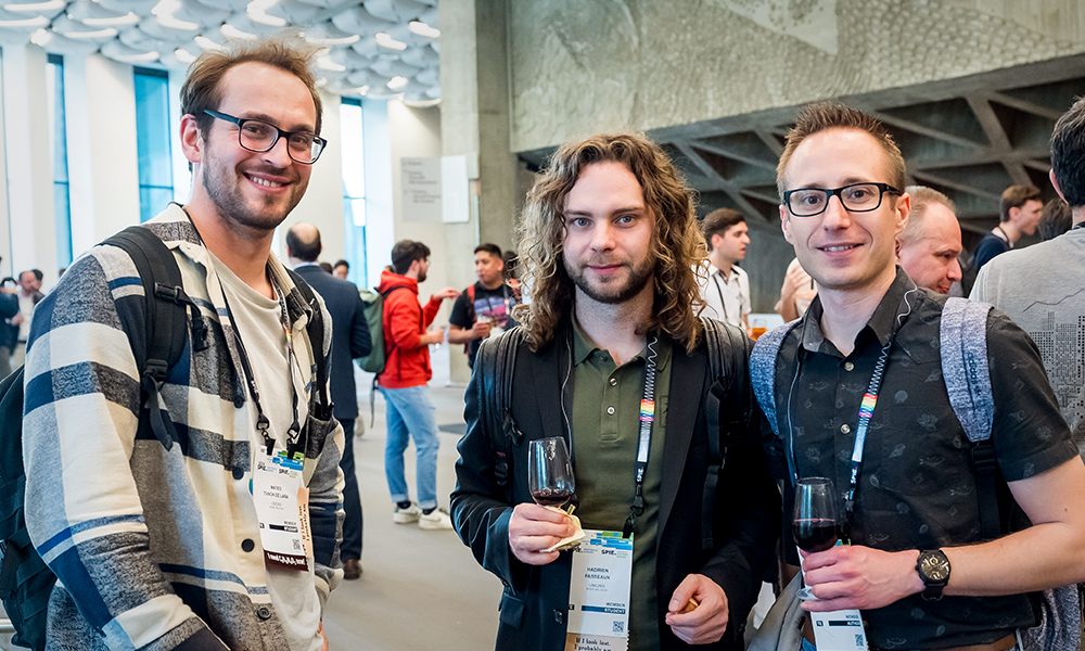 Attendees networking at Optical Systems Design