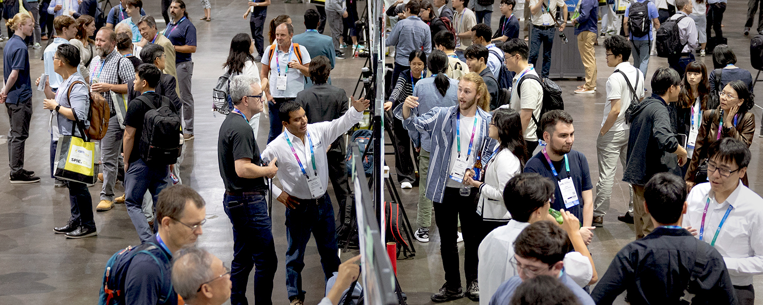 The poster session in full swing with many people and conversations.
