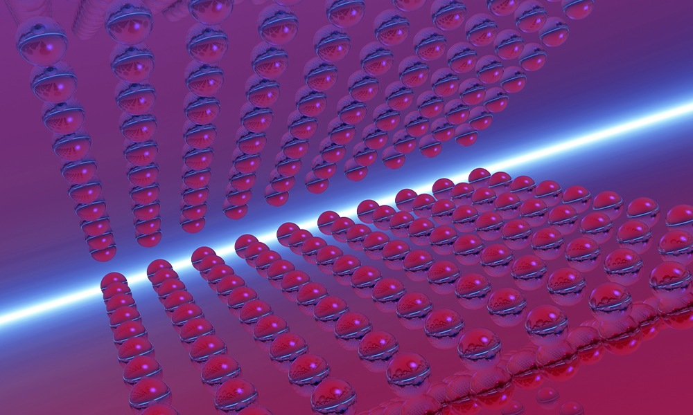 Abstract visualization of low-dimensional materials, with rows of spherical particles in a purple and blue gradient.