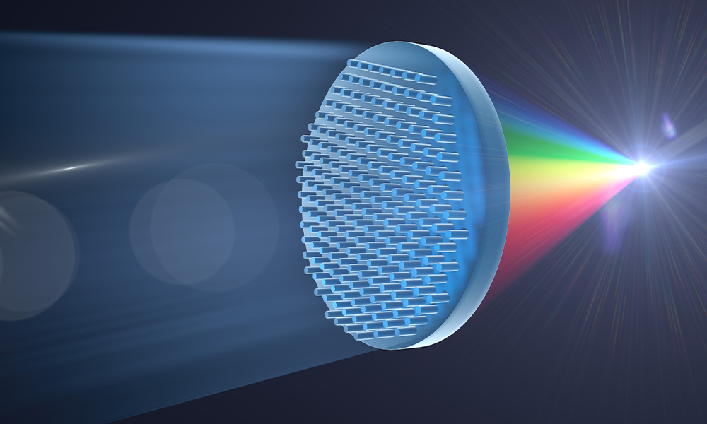 Optical trapping illustration with a lens focusing light into a rainbow spectrum beam.