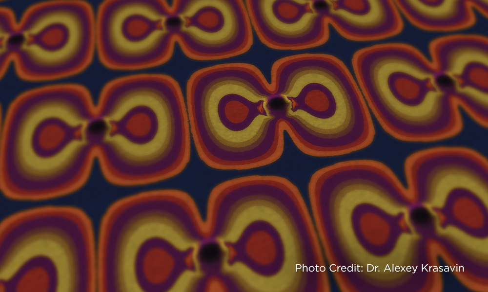 Pattern with vibrant concentric shapes in red, orange, and purple tones.