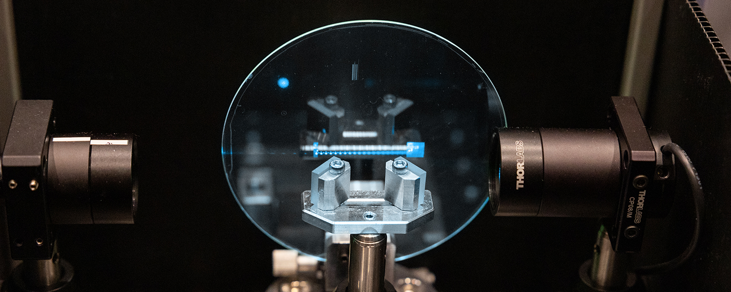 Close-up view of a high-precision optical device with two cameras and a circular glass component in the center, used for detailed measurements or inspections. This device is integral to augmented reality (AR), virtual reality (VR), and mixed reality (MR) technology systems, enhancing accuracy and immersive experiences.