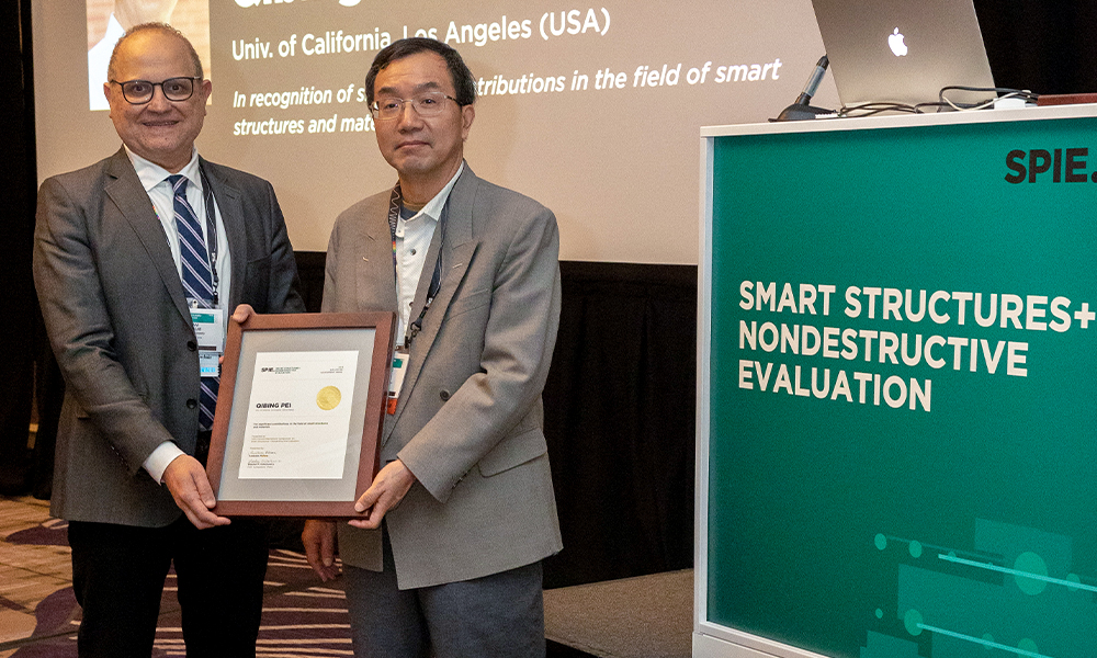 Mentors and students at a SPIE Smart Structures award  event