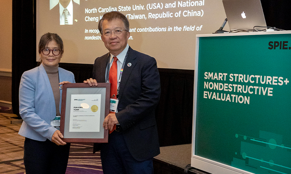 Award winner posing with SSNDE Chair