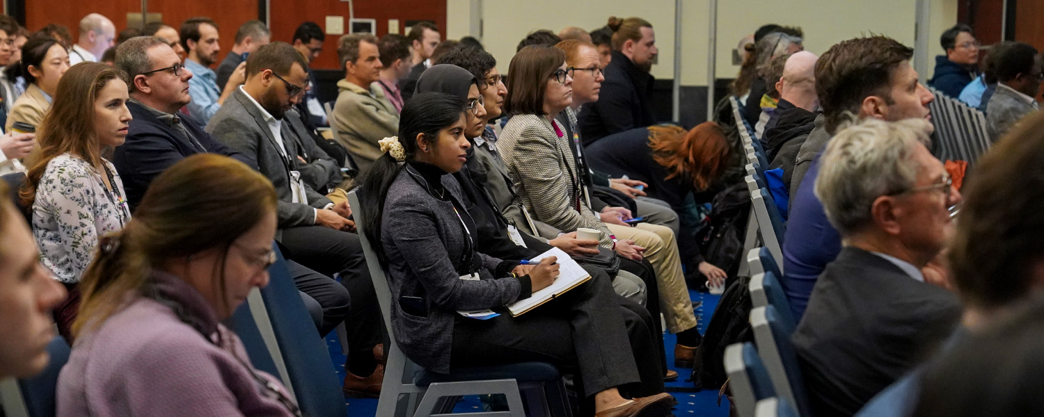 An attendee listens to work being shared at SPIE Smart Structures + NDE
