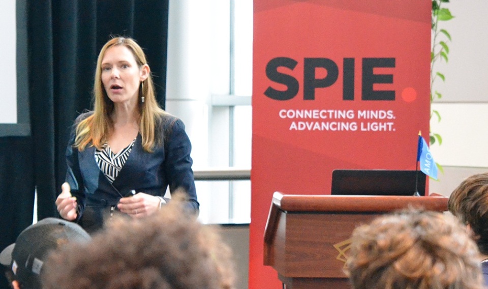 Female course instructor with SPIE branding in the background