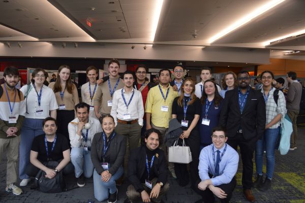 Group photo of SPIE Student Members from the University of Ottawa SPIE Student Chapter, standing and kneeling together at an indoor conference venue, wearing conference badges; the chapter is the recipient of the 2026 Presidential Award for Outstanding Student Chapter.