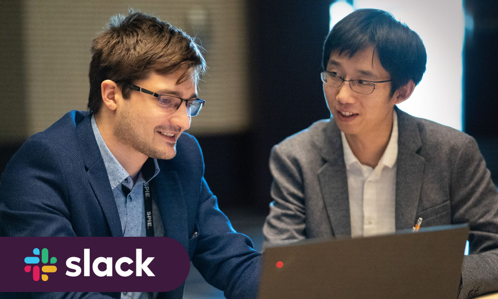 Two SPIE Student Members at a laptop computer