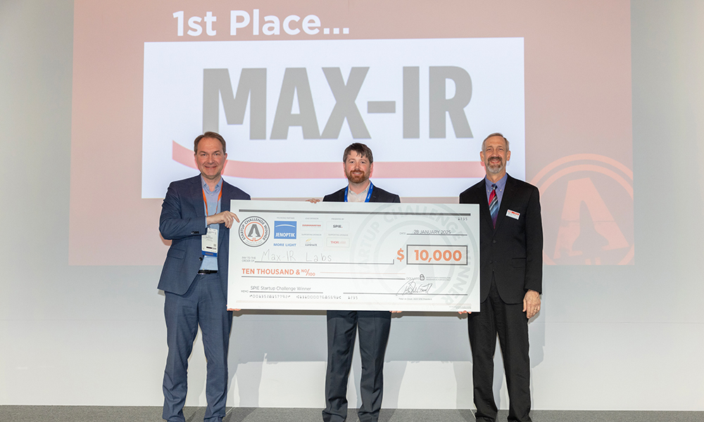 Jenoptik’s Ralf Kuschnereit, 2025 SPIE Startup Challenge winner Max-IR Lab's Trey Daunis, and 2025 SPIE President Peter de Groot.